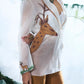 White Blazer With Big Embroidered Deer Paired With Pure Dupian Flared Pant - Ankush Jain